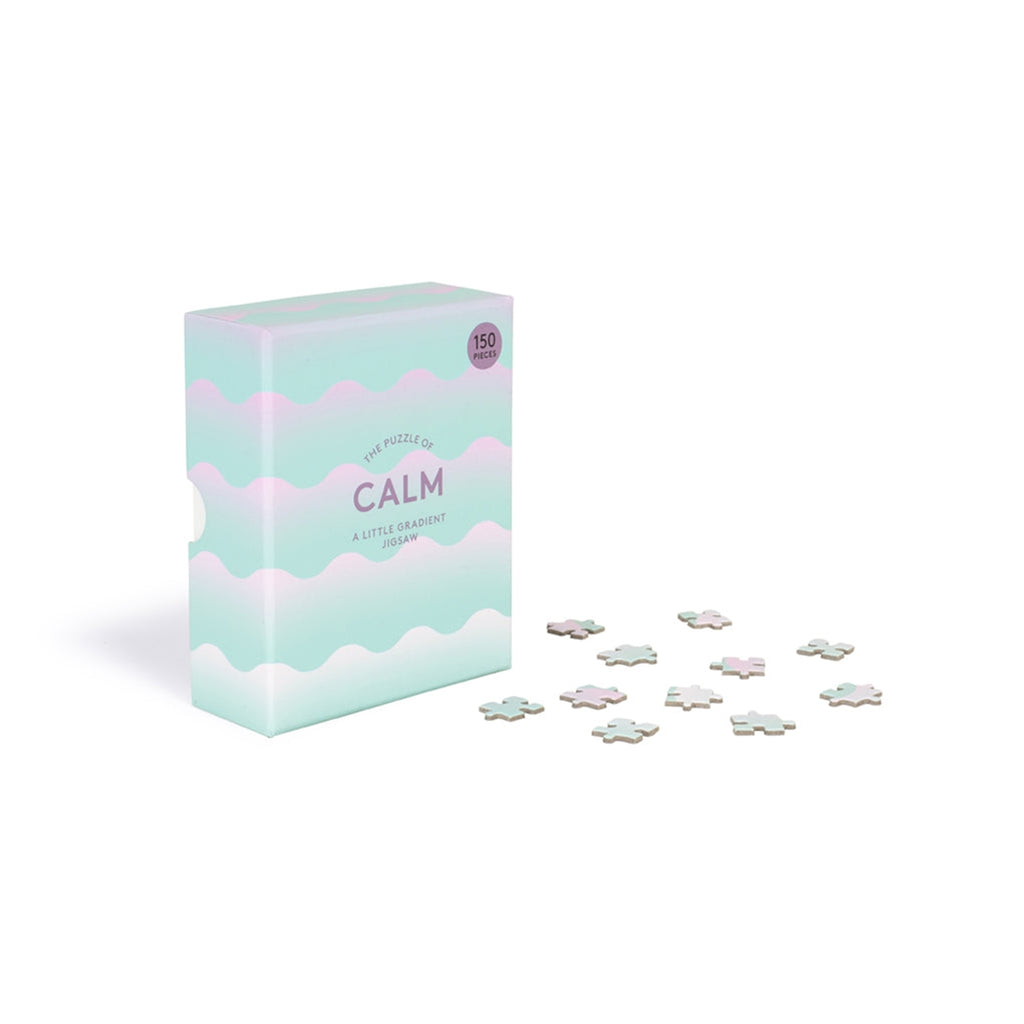 The puzzle of calm, Verpackungskarton, daneben einzelne Puzzleteile 