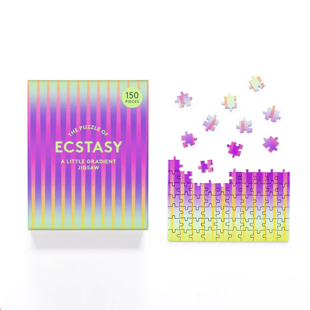The puzzle of ecstasy Verpackungskarton, daneben das teilweise fertige Puzzle
