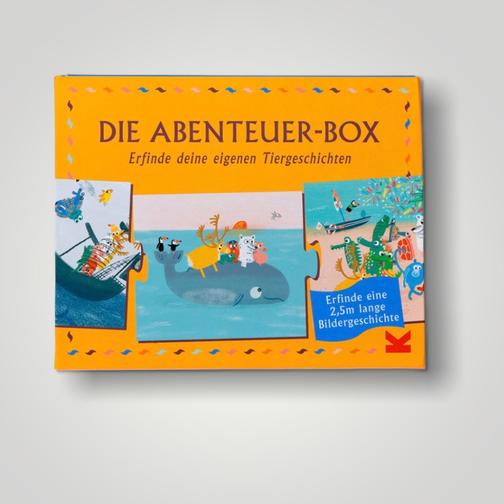 Orangefarbener Karton "Die Abenteuer-Box Erfinde deine eigenen Tiergeschichten" mit abgebildeten Puzzleteilen