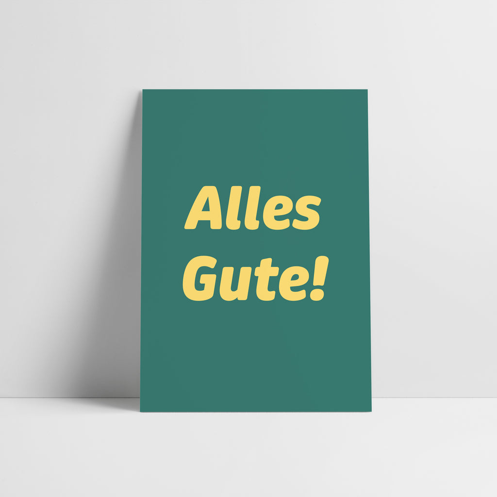 Grüne Postkarte mit gelber Schrift "Alles Gute!"