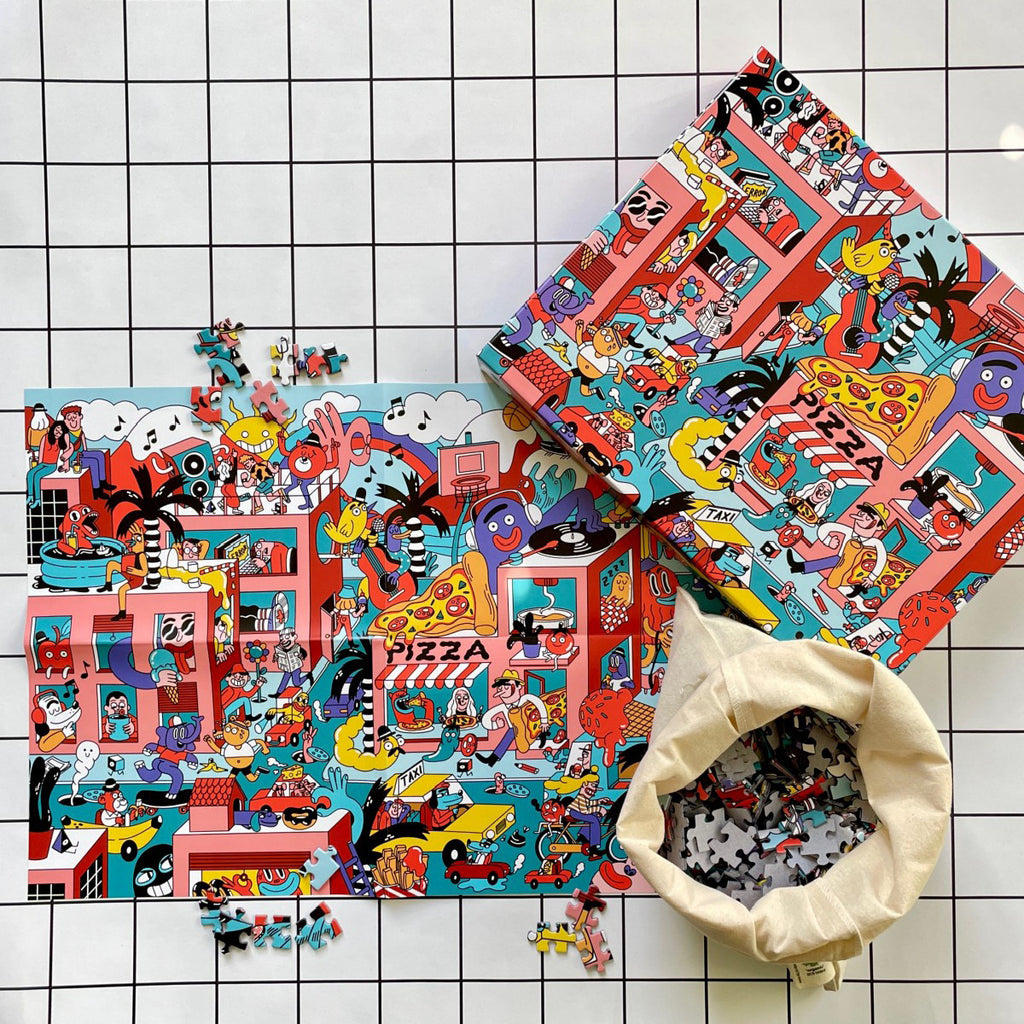 Heat Waves Puzzle Verpackungskarton und Stofftasche mit Puzzleteilen von oben fotografiert
